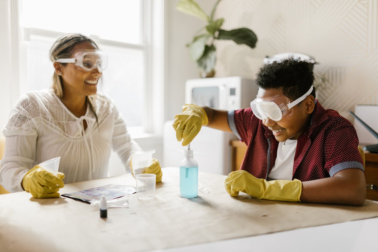 A mother and son engaged in a fun and educational science experiment at home, fostering quality family time.